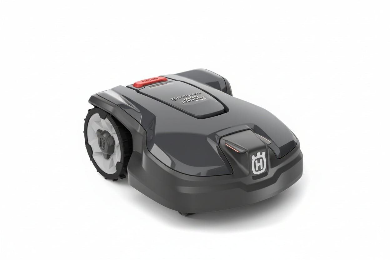 Husqvarna robotic lawnmower in dark gray and black with a red button and white Husqvarna logo, shown on a light gray background.