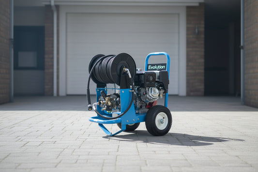 A blue and black Evolution brand portable pressure washer with an attached hose reel, mounted on a wheeled frame with a visible engine.